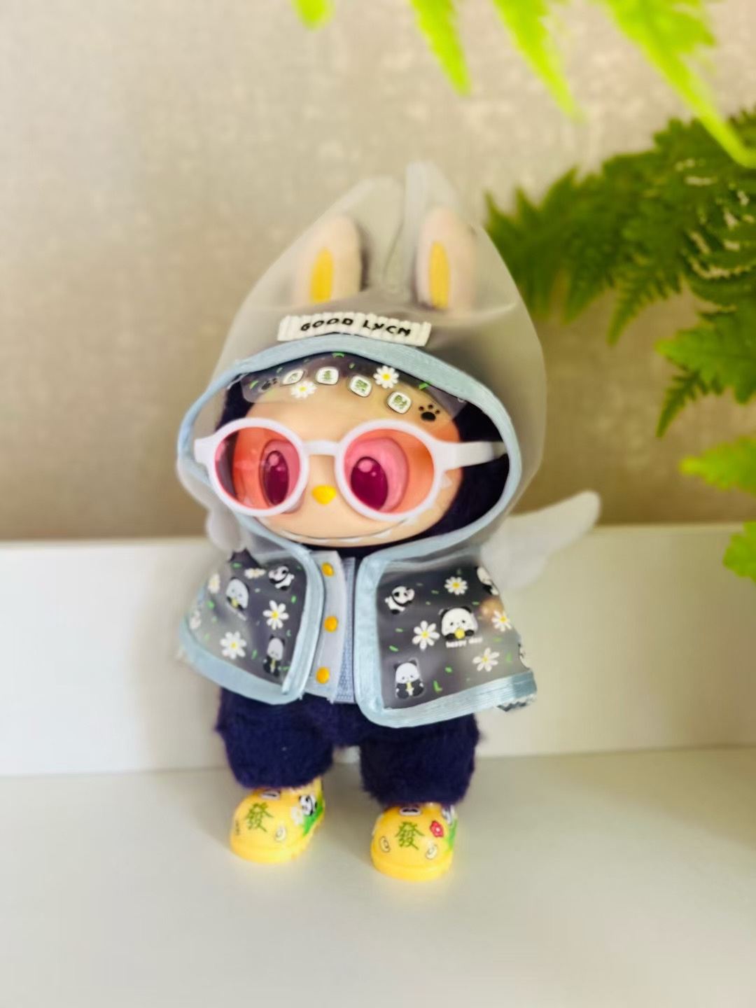Labubu trendy glasses, rain boots and raincoat suit