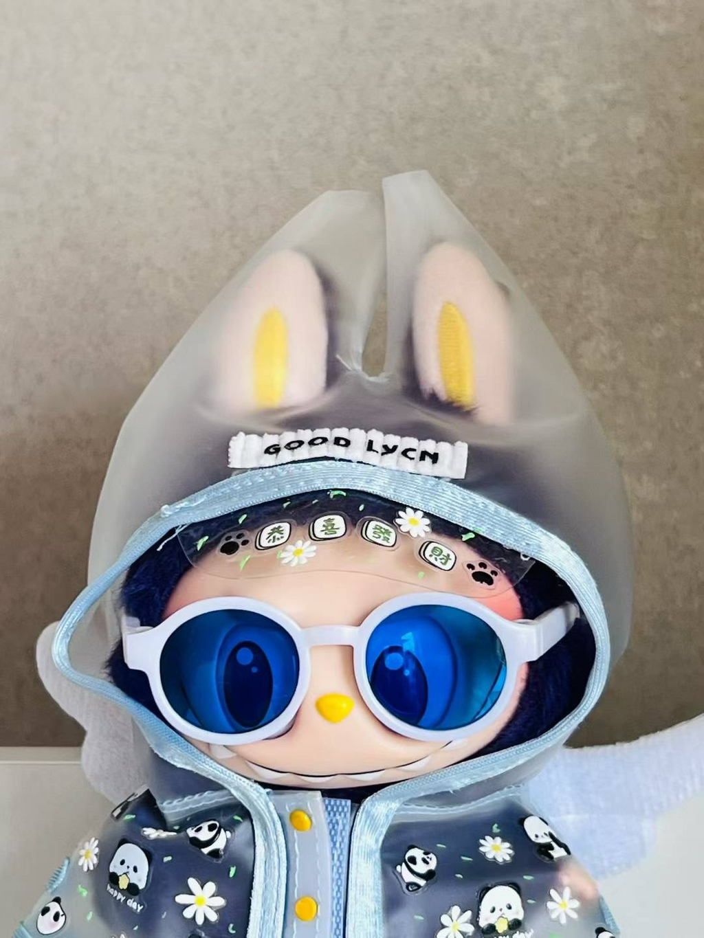 Labubu trendy glasses, rain boots and raincoat suit
