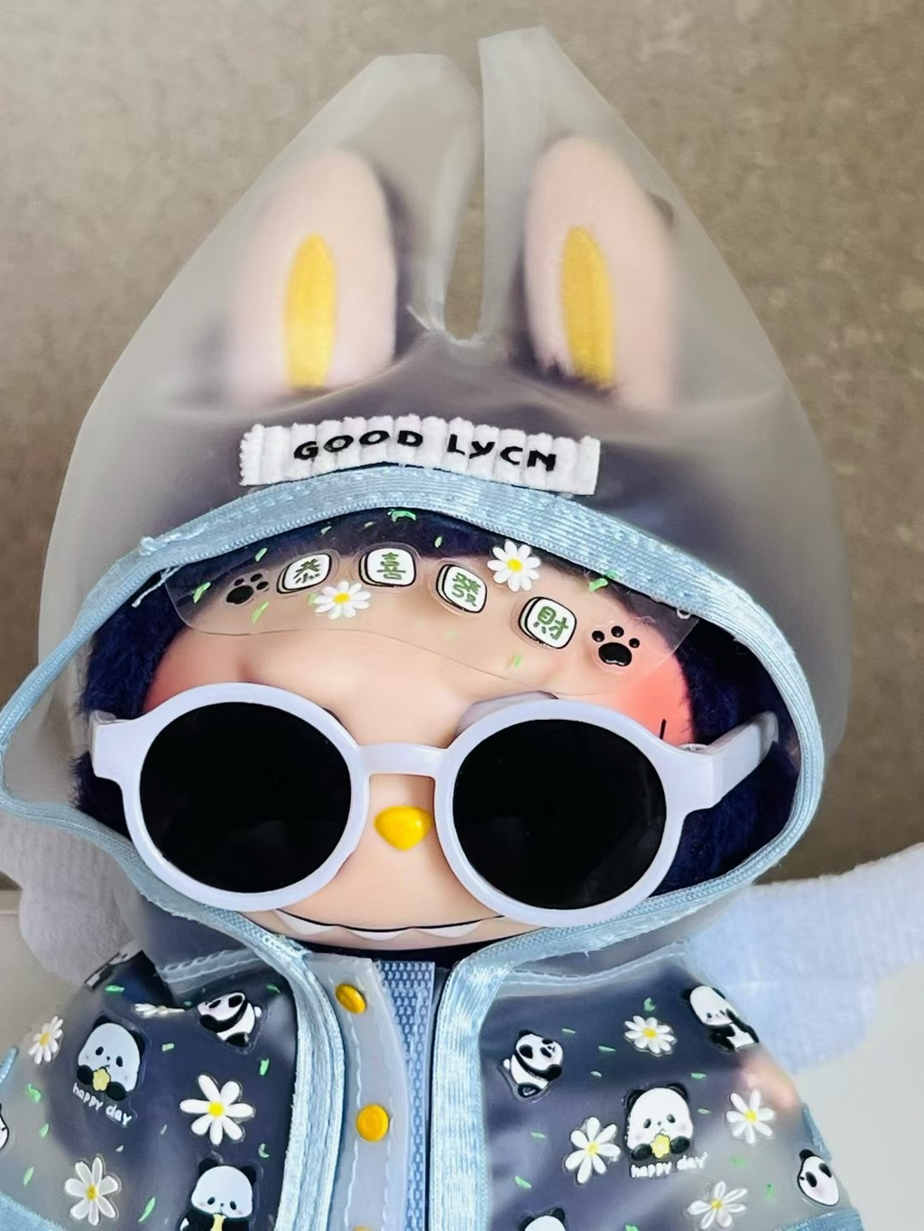 Labubu trendy glasses, rain boots and raincoat suit